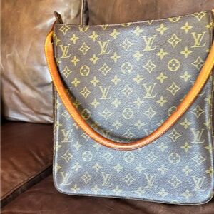 Brown purse in good shape with a few small imperfections